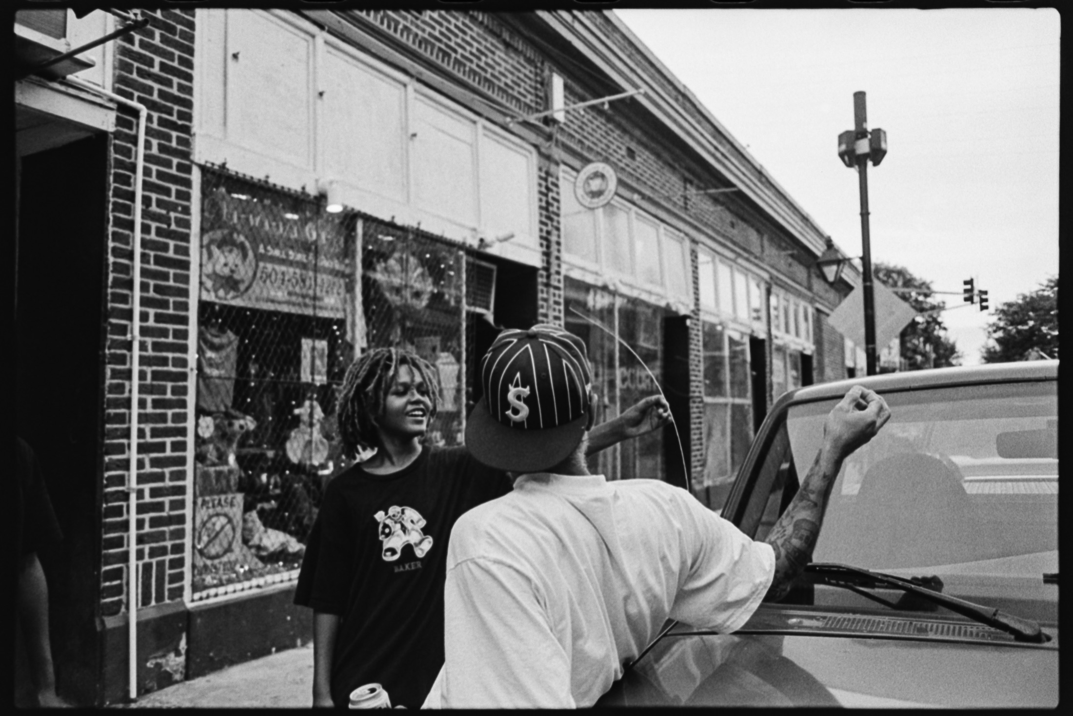 Friends talking beside a truck in New Orleans