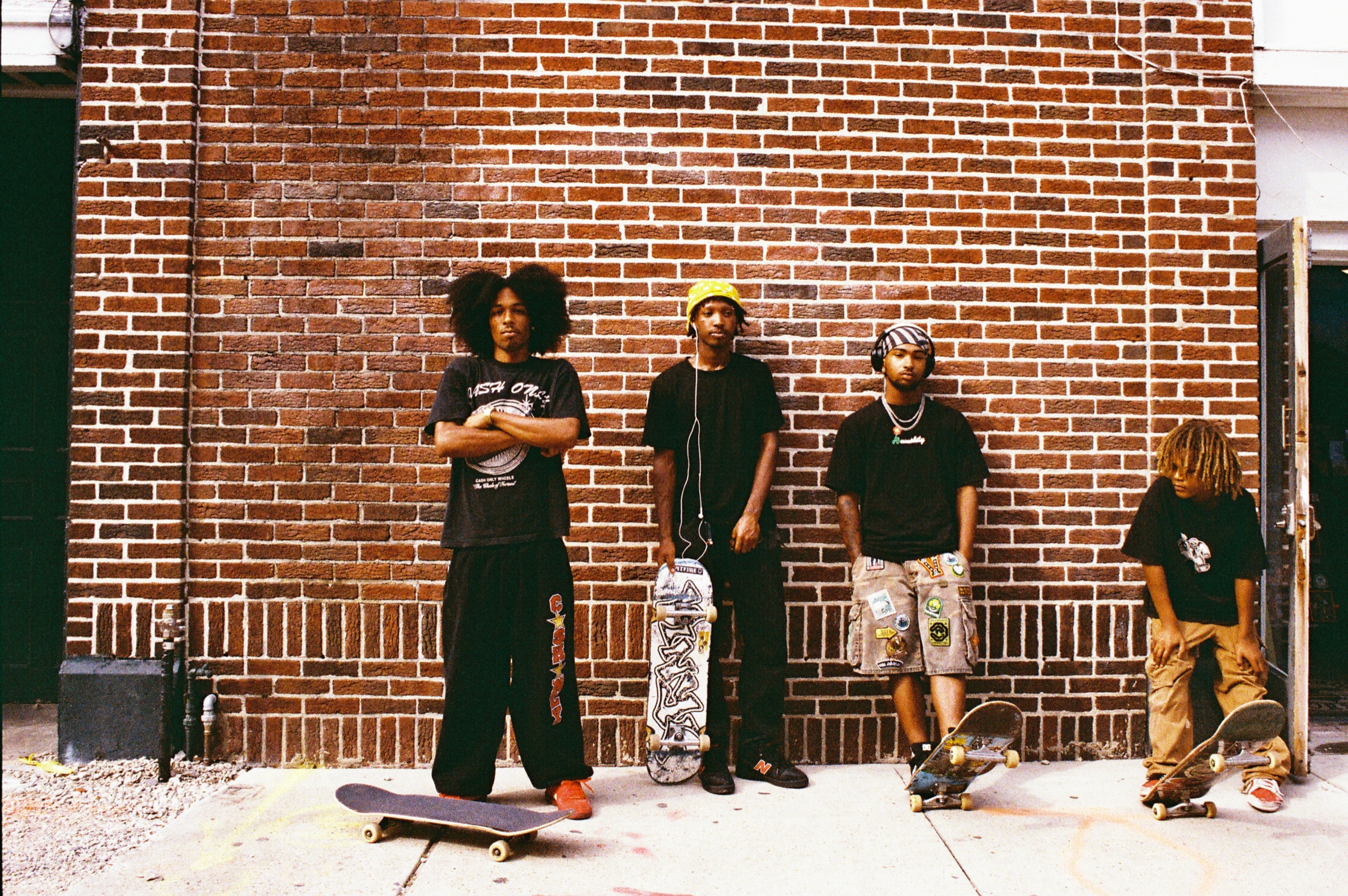 Street Star crew lined up beside a brick wall in New Orleans